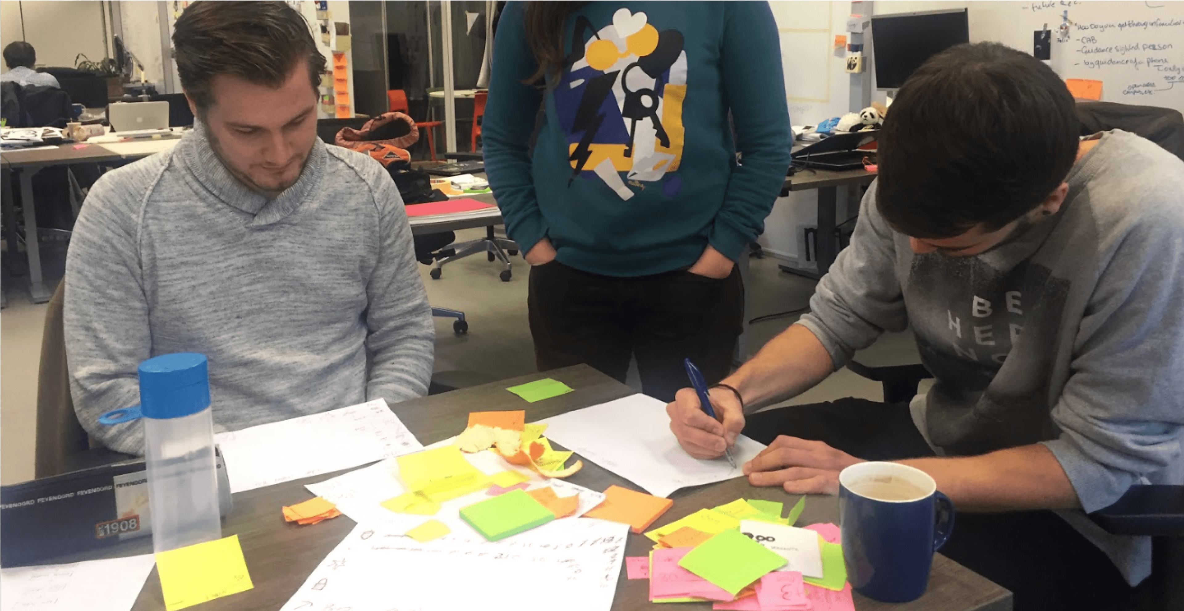 A picture taken during in the early stages of the project, paper prototyping the concept of LiveStock